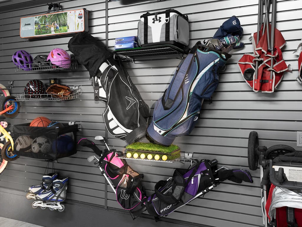 golf bag and sports gear on a slatwall 
