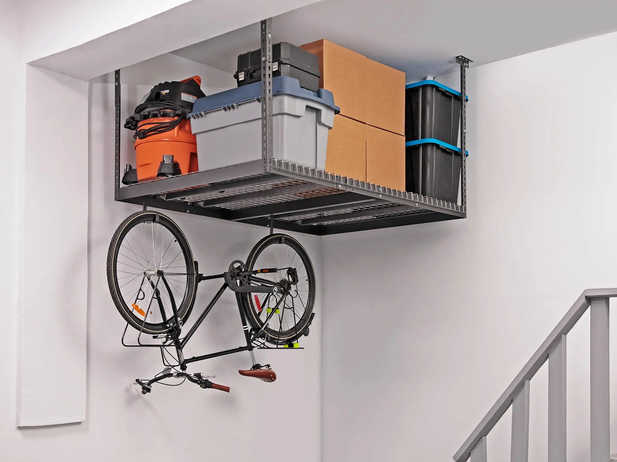 bike stored upside down on ceiling mounted storage rack