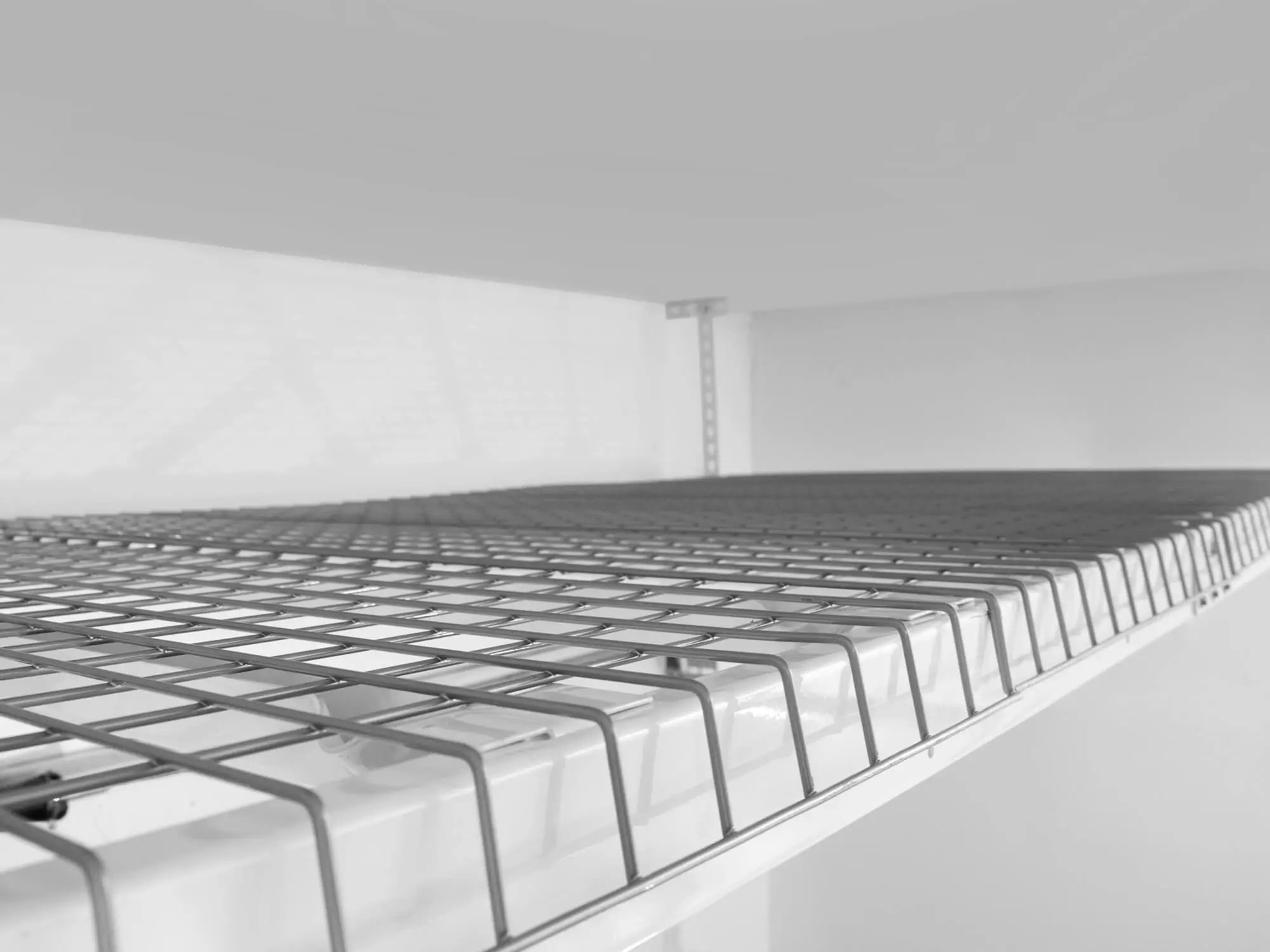 empty white overhead storage rack 