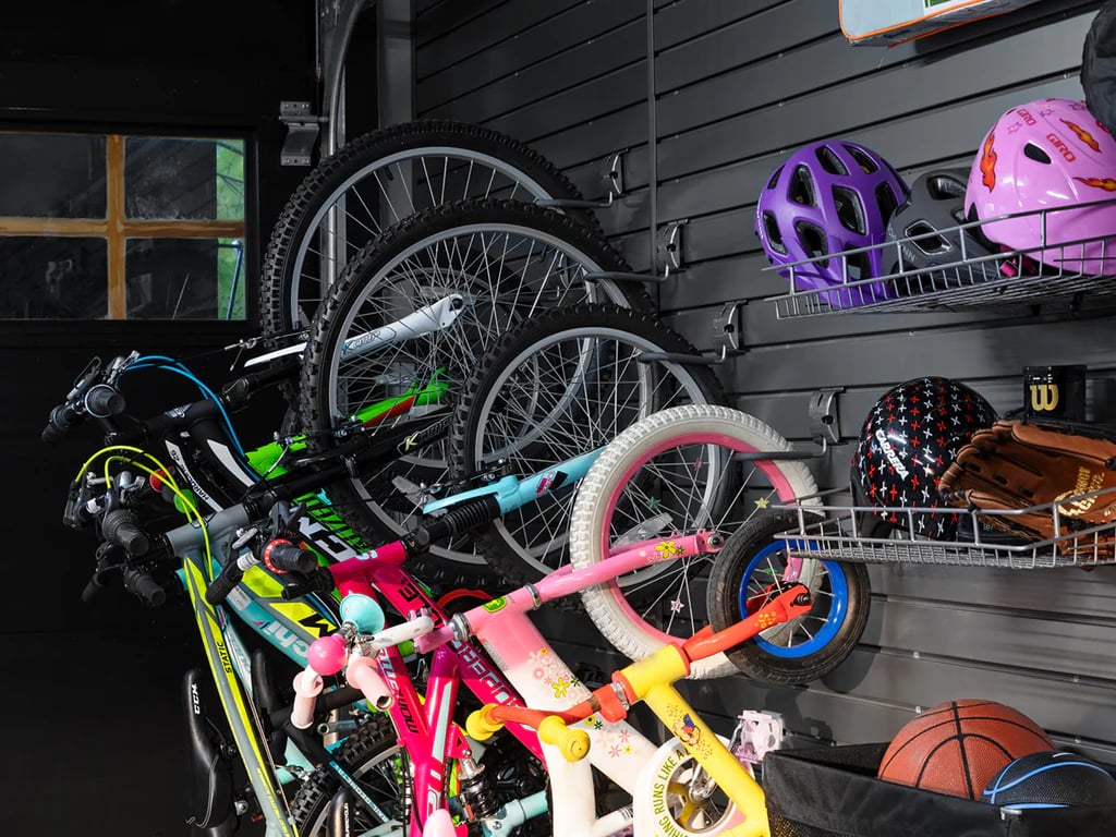 bikes hanging on slatwall storage system in garage