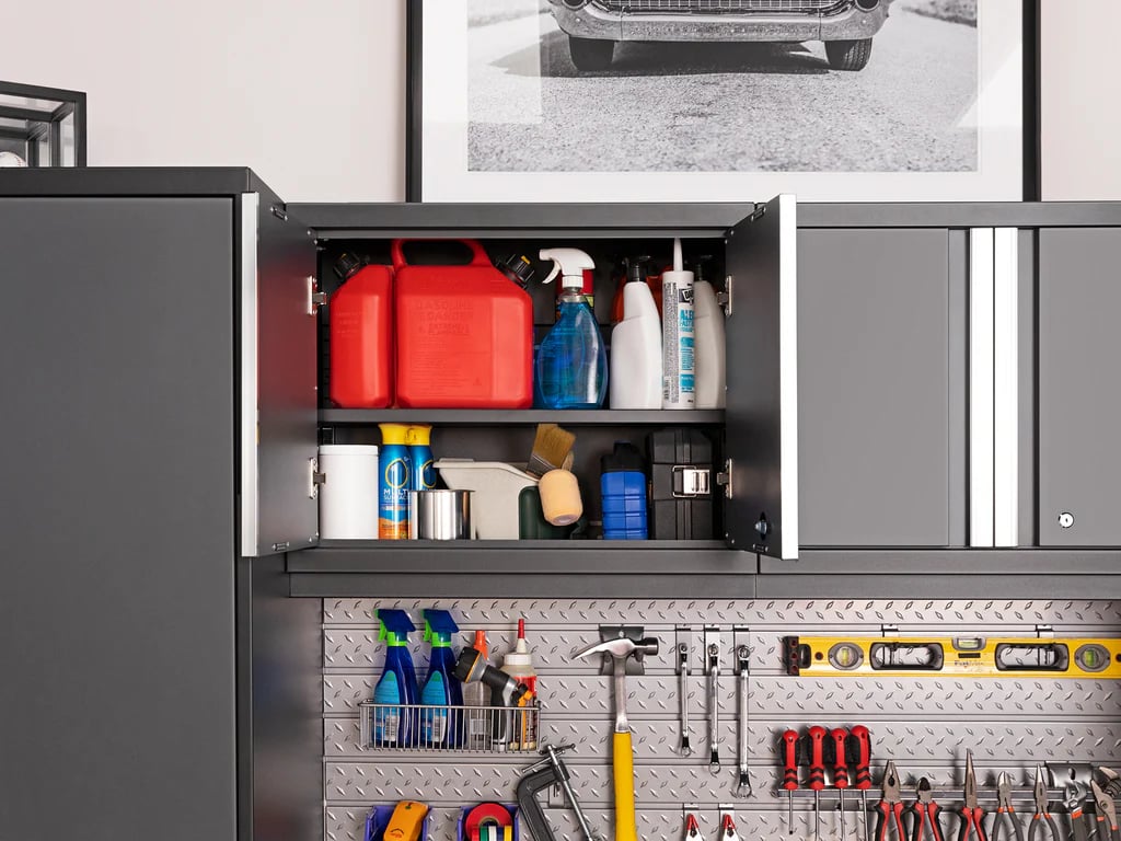 dark cabinets with open doors and cleaning supplies on show
