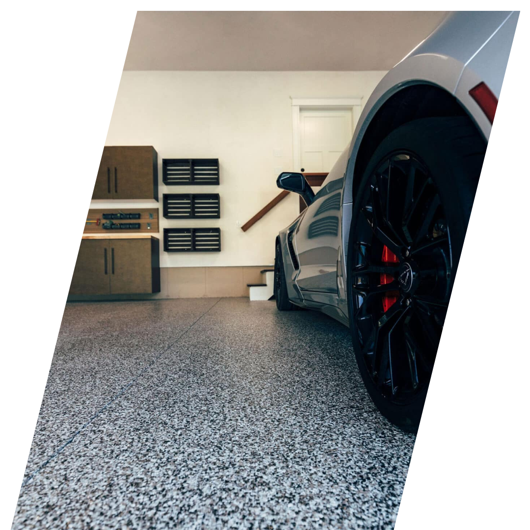 polyaspartic garage floor with gray black white flakes